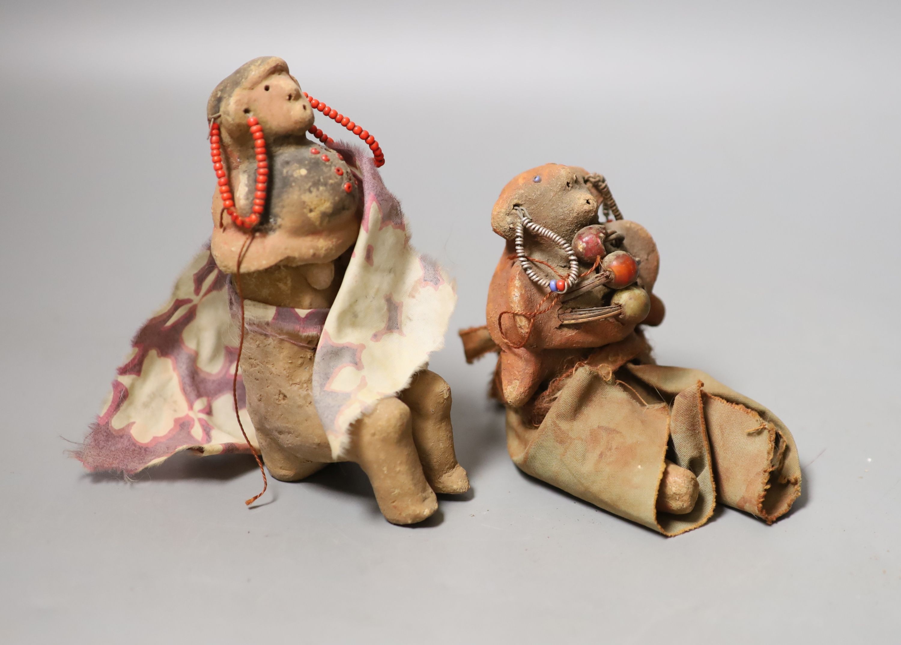 2 Tanzanian terracotta cloth and beadwork medicine or witch doctor figures-  Provenance- vendors parents bought figures in Nairobi in